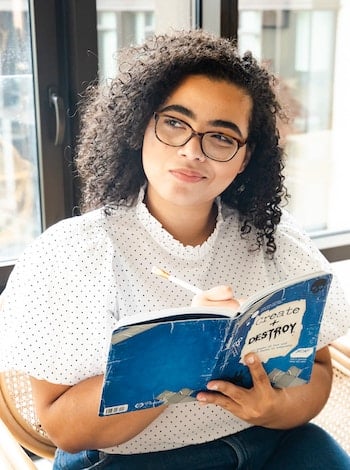 girl thinking writing