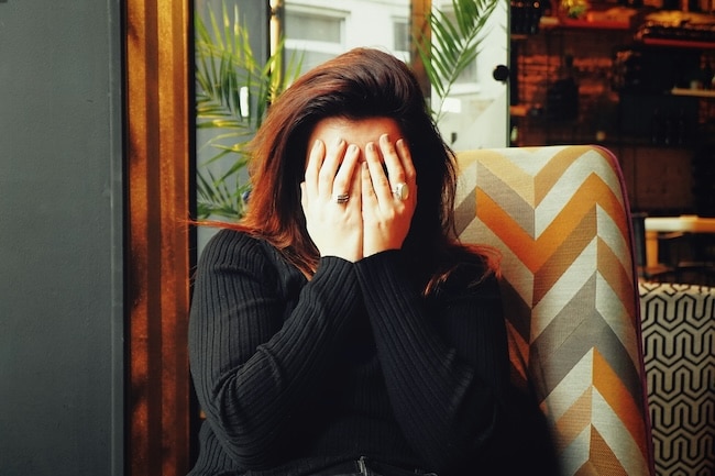 writing passive voice evasion - woman hiding face